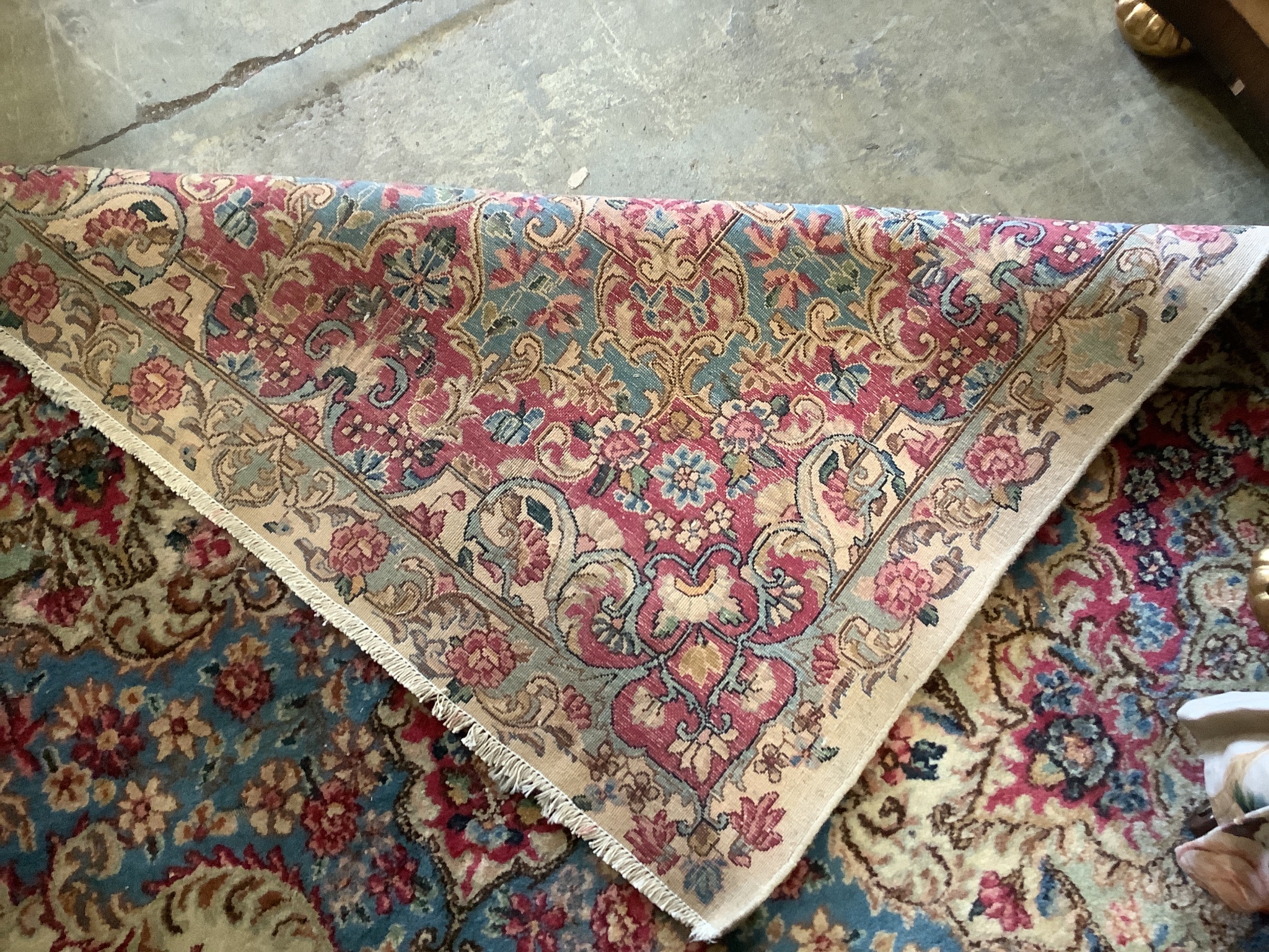 A large Tabriz ivory ground floral carpet, 500 x 300cm